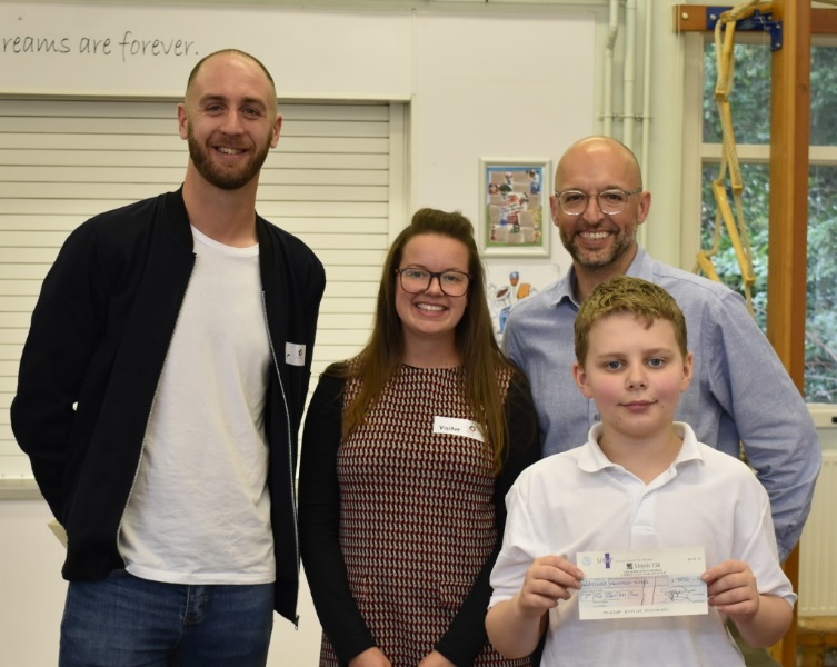 SH&P staff with Woodstock School pupil